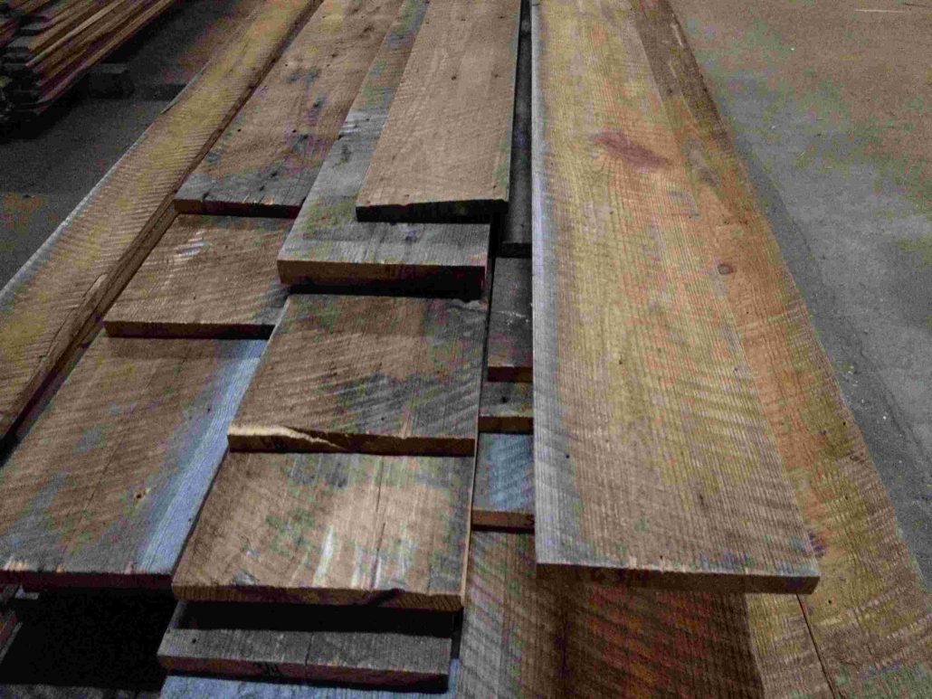 Reclaimed wood planks that have been salvaged from old structures